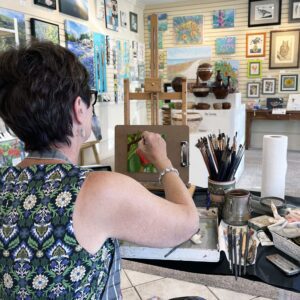 Allison Armstrong demonstrates oil painting at persimmon